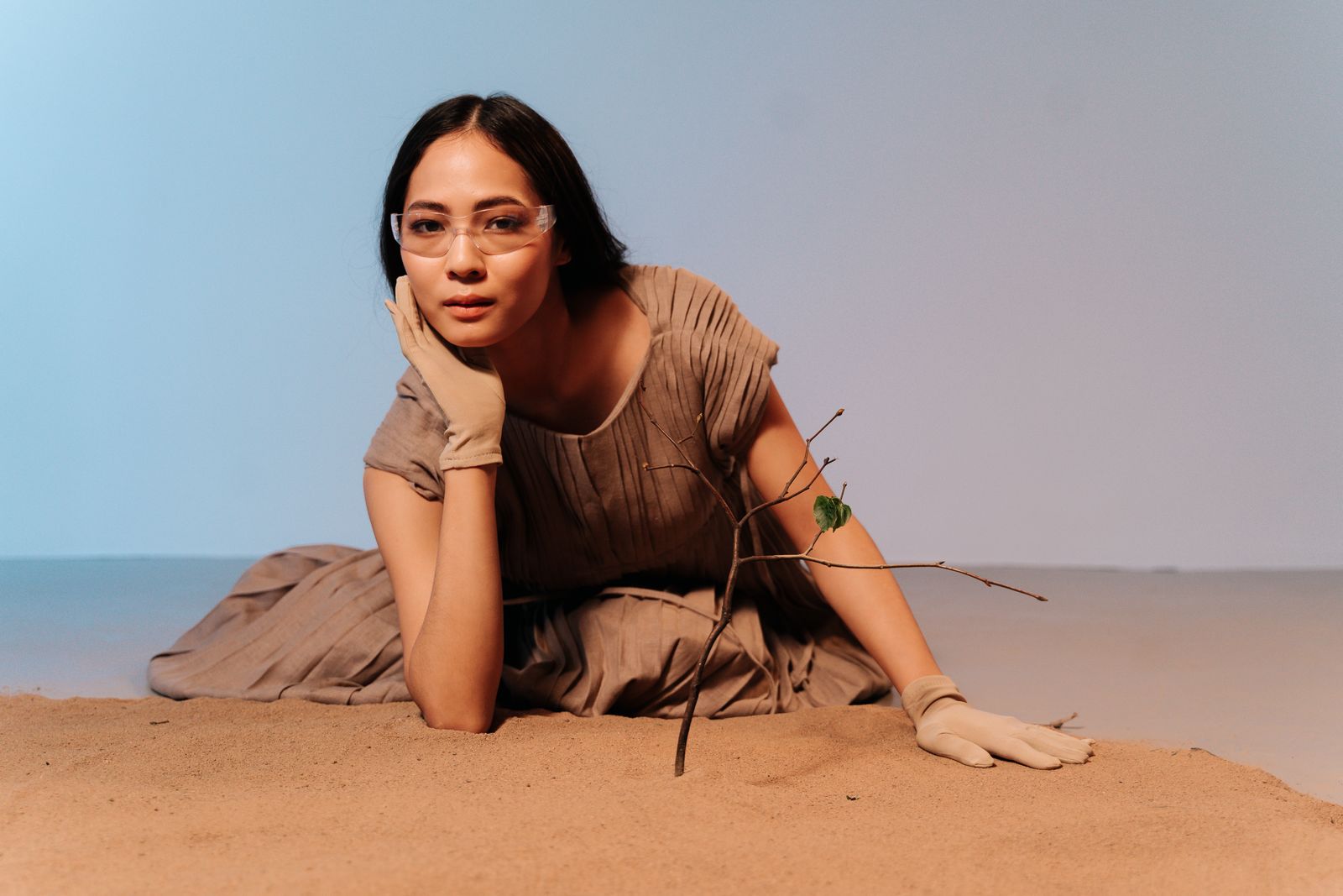 Woman wearing elegant tan ladies' leather gloves